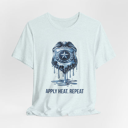 Apply Heat Repeat t-shirt by Moral Fabric — melting ICE badge graphic on progressive activist tee