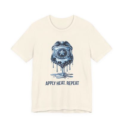 Apply Heat Repeat t-shirt by Moral Fabric — melting ICE badge graphic on progressive activist tee