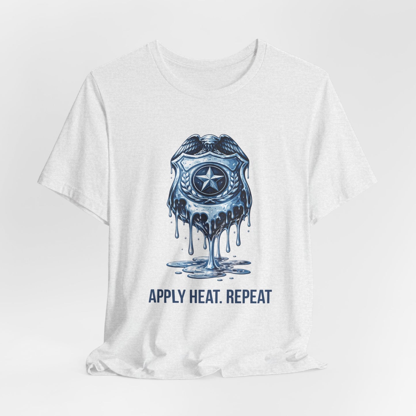 Apply Heat Repeat t-shirt by Moral Fabric — melting ICE badge graphic on progressive activist tee