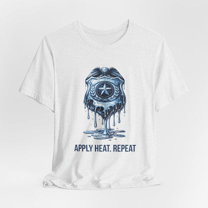 Apply Heat Repeat t-shirt by Moral Fabric — melting ICE badge graphic on progressive activist tee