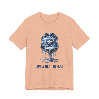 Apply Heat Repeat t-shirt by Moral Fabric — melting ICE badge graphic on progressive activist tee