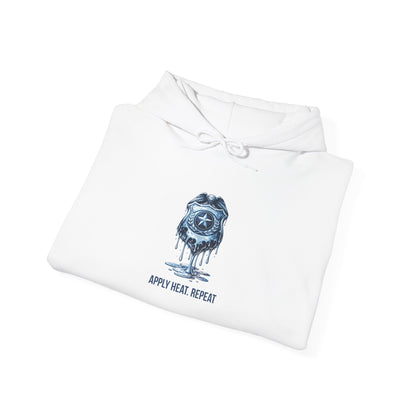 Apply Heat Repeat anti-ICE hoodie by Moral Fabric — melting badge graphic on progressive political streetwear
