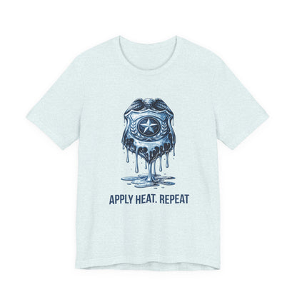 Apply Heat Repeat t-shirt by Moral Fabric — melting ICE badge graphic on progressive activist tee