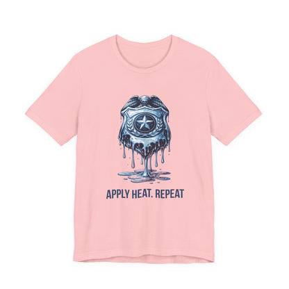 Apply Heat Repeat t-shirt by Moral Fabric — melting ICE badge graphic on progressive activist tee