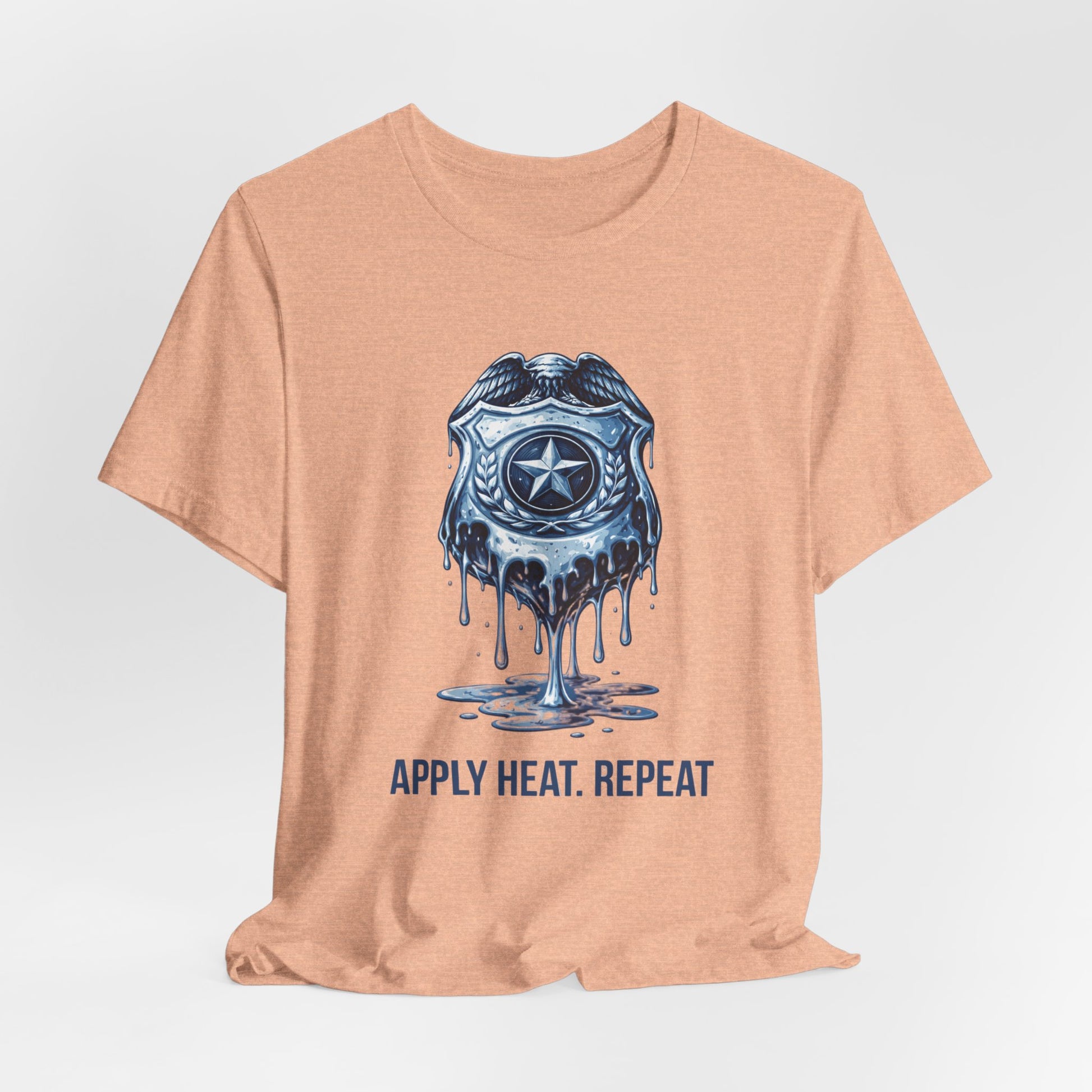 Apply Heat Repeat t-shirt by Moral Fabric — melting ICE badge graphic on progressive activist tee