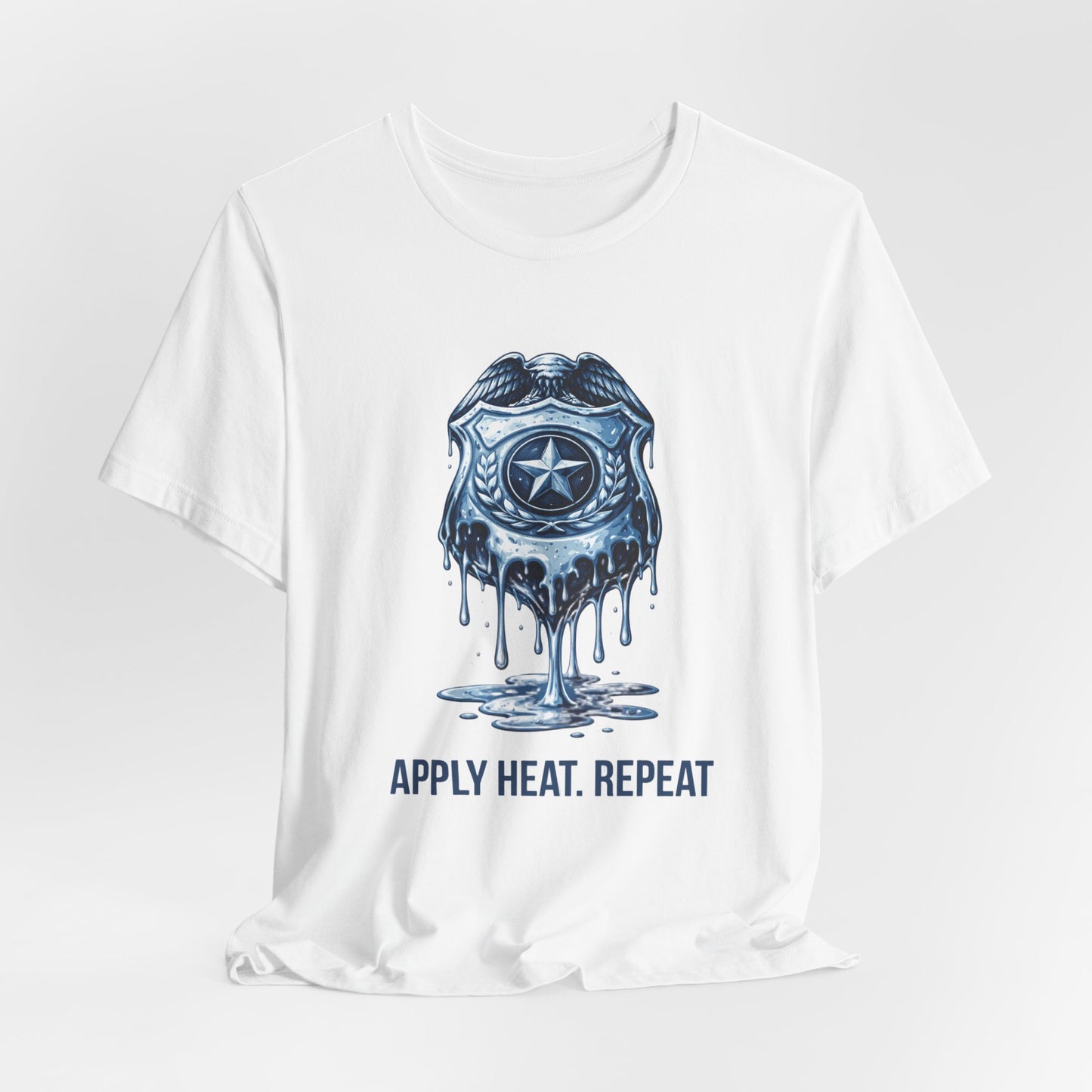 Apply Heat Repeat t-shirt by Moral Fabric — melting ICE badge graphic on progressive activist tee