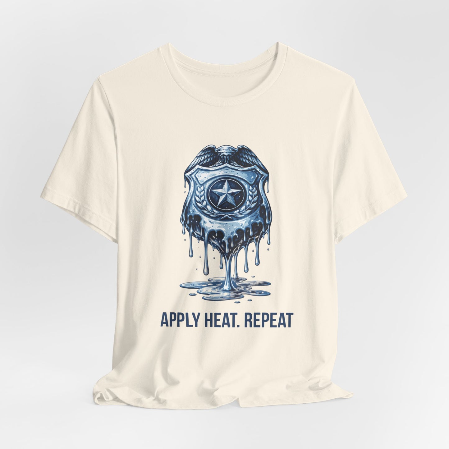 Apply Heat Repeat t-shirt by Moral Fabric — melting ICE badge graphic on progressive activist tee