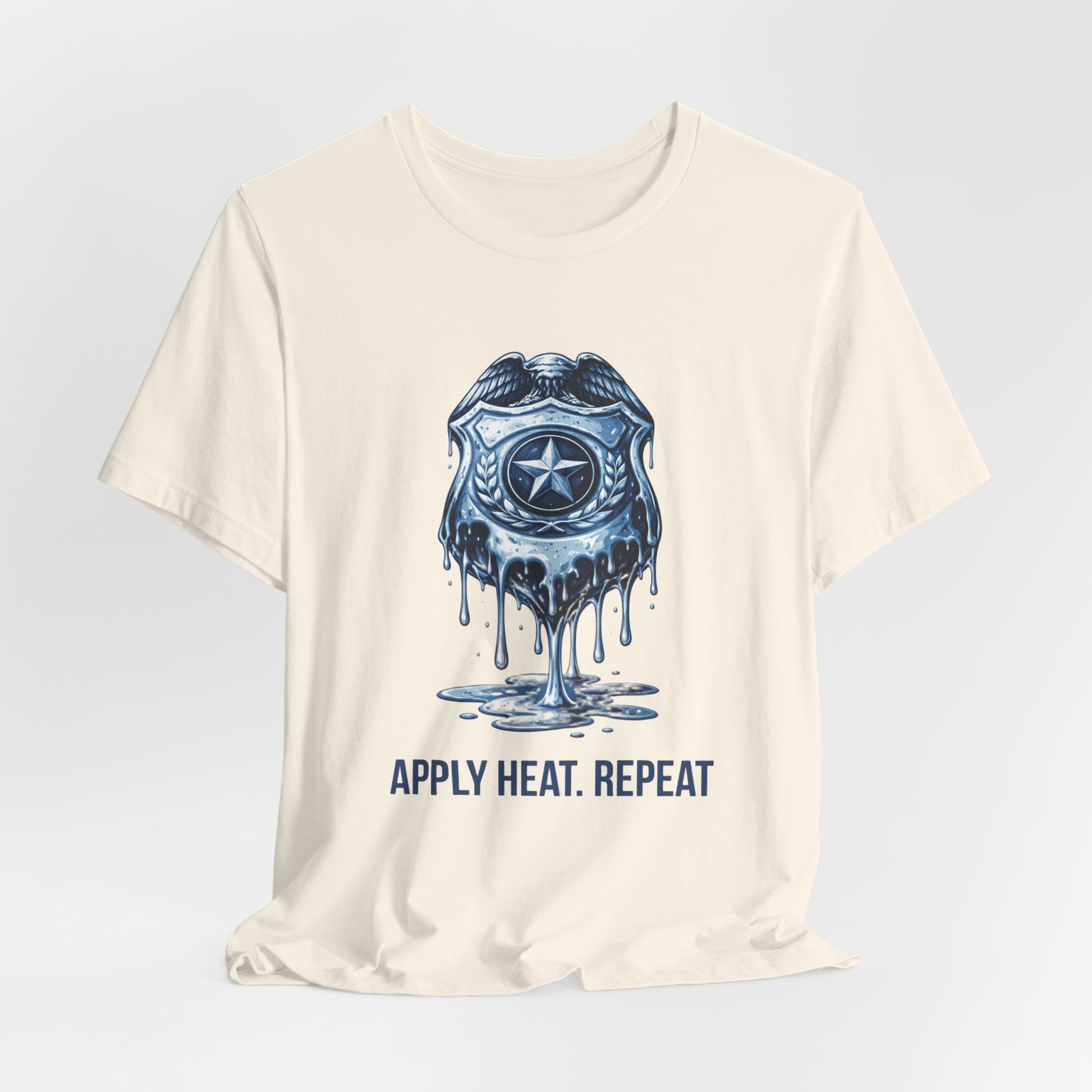 Apply Heat Repeat t-shirt by Moral Fabric — melting ICE badge graphic on progressive activist tee