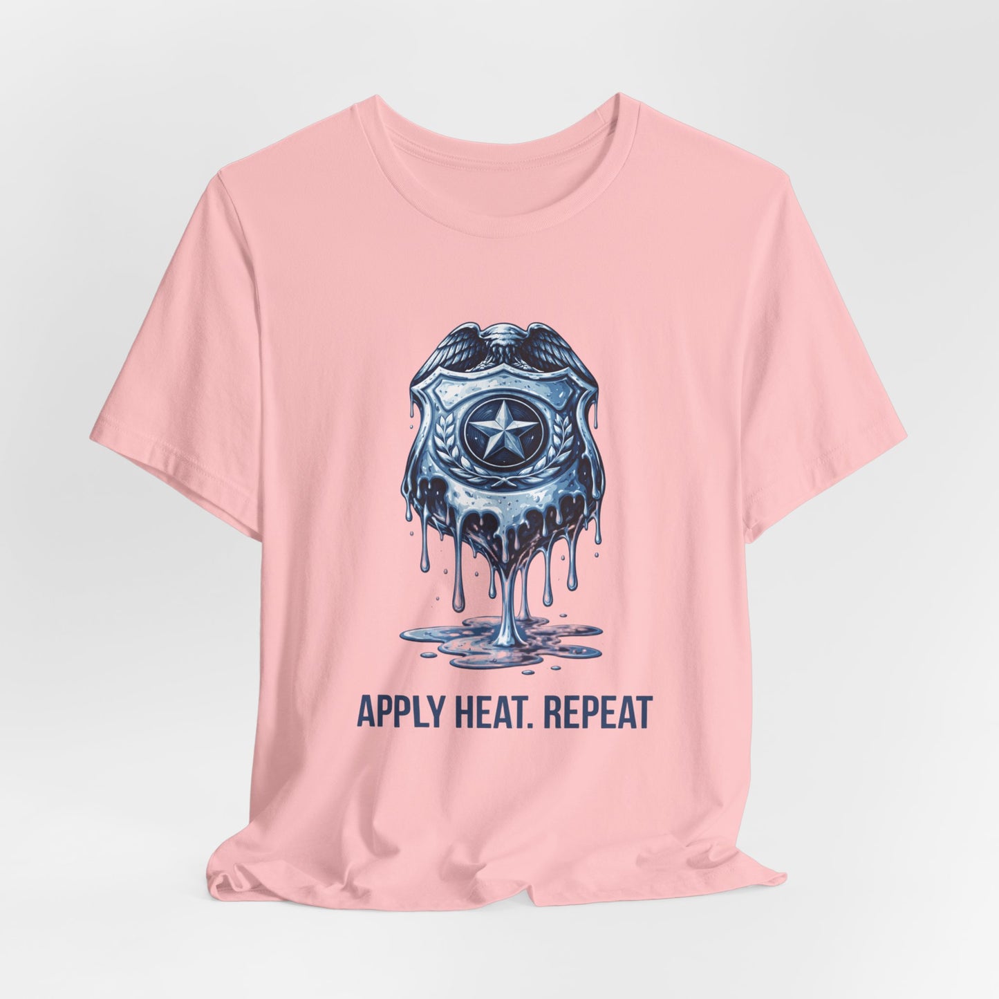 Apply Heat Repeat t-shirt by Moral Fabric — melting ICE badge graphic on progressive activist tee